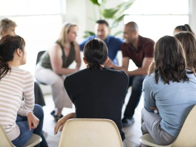 Diverse people in a supporting group session