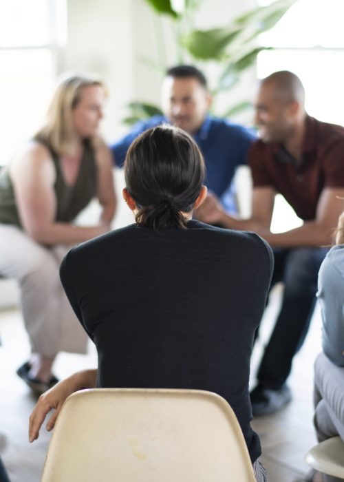Diverse people in a supporting group session